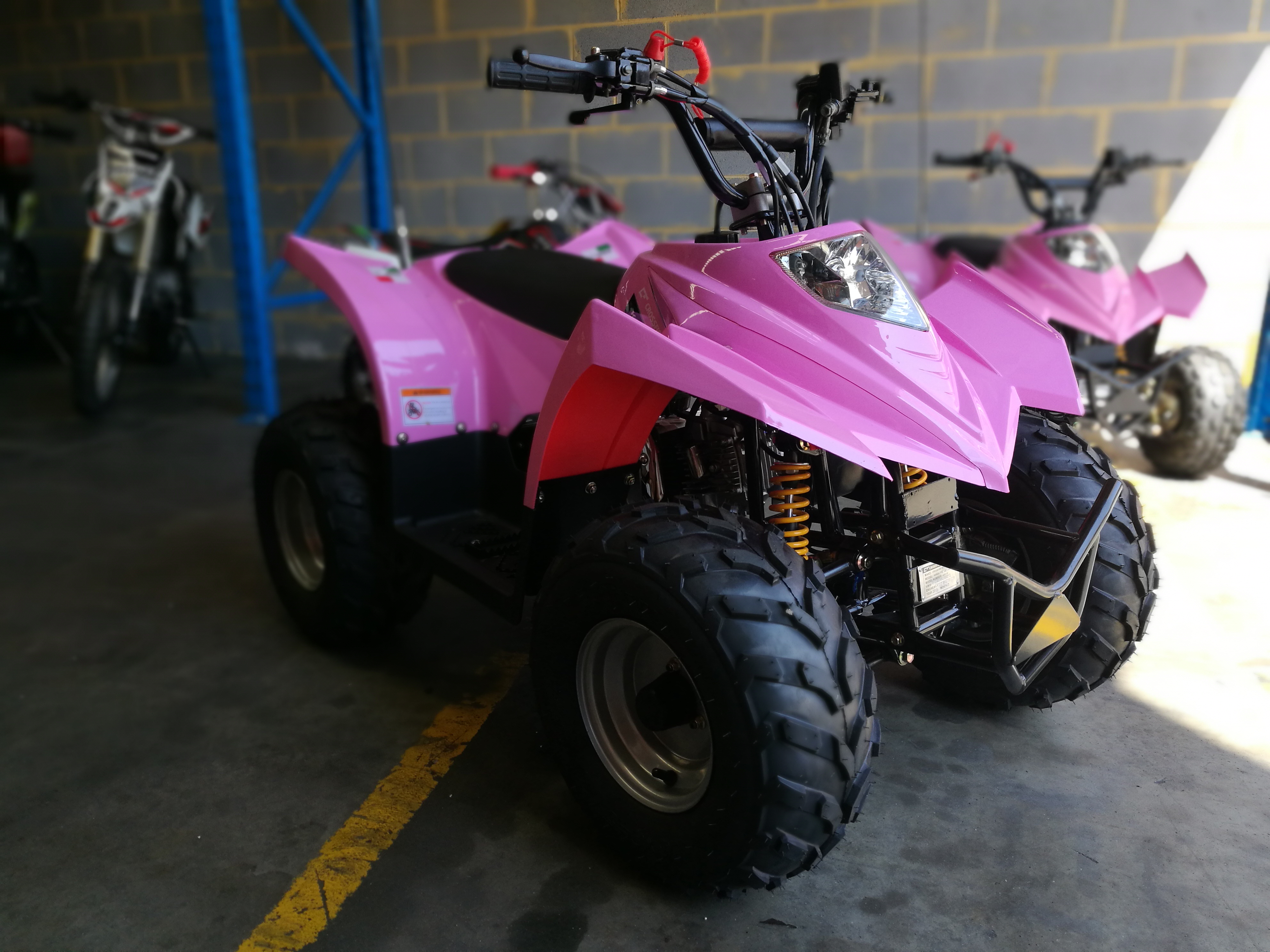 kids pink quad bike